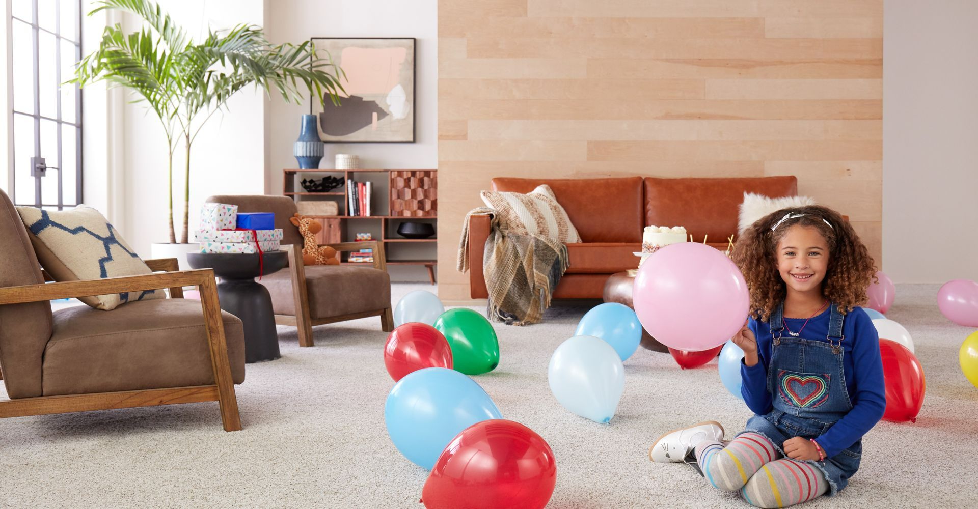 kids playing on newly installed Carpet One vinyl flooring in playroom